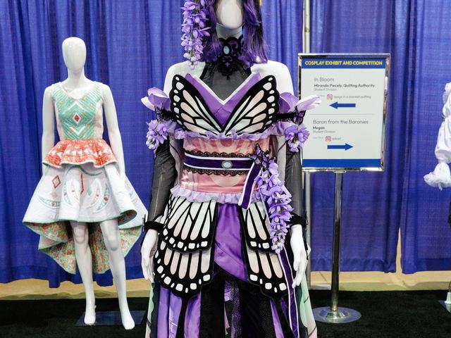 A butterfly-winged cosplay costume on a mannequin