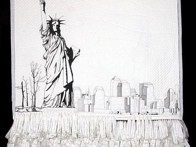 Detail of the quilt Remember Me, showing the Statue of Liberty and the New York skyline in black on white