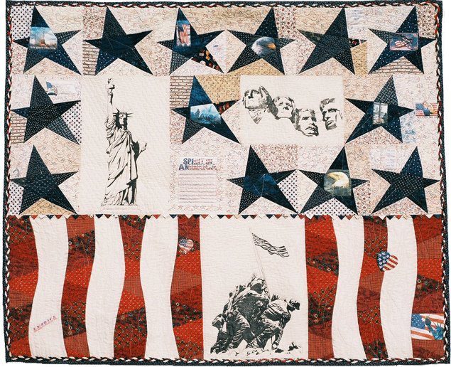 United in Spirit, a quilt of navy stars and red and white stripes with printed panels of American landmarks and memorials